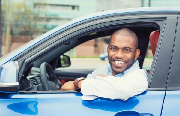 man in car