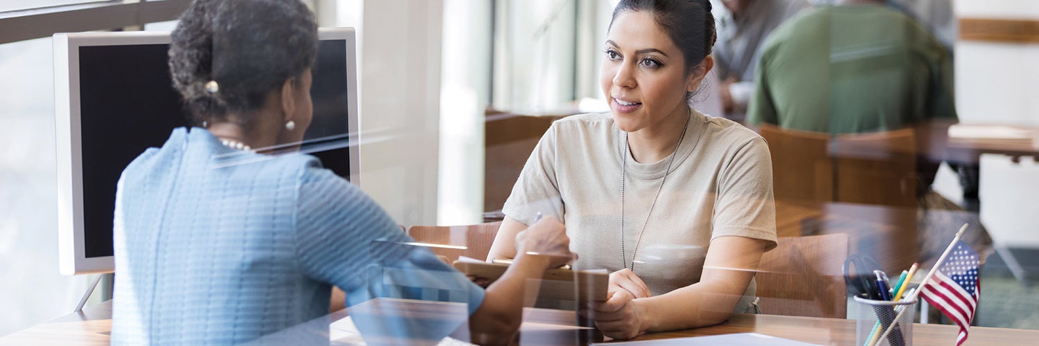 Female veteran speaking with bank representative