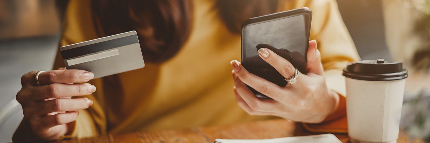 A woman managing her finances on her phone.