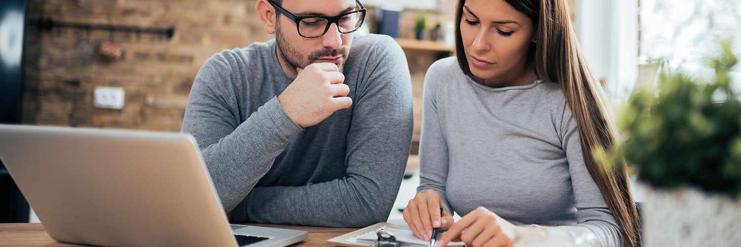 A man and a woman review their finances together.