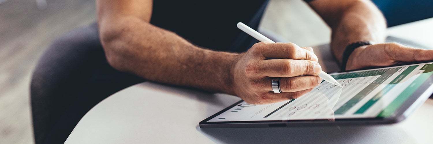 A man working on a tablet.