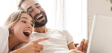 man and women laugh about something