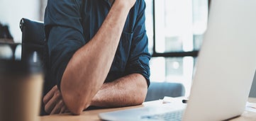 man at computer desk