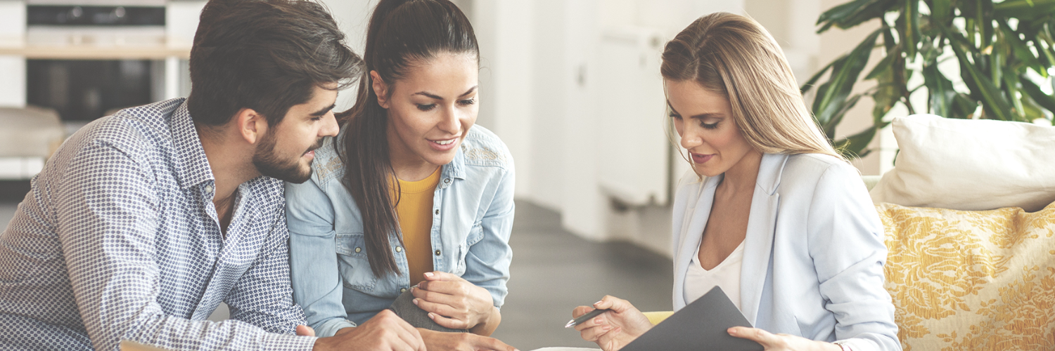three people read documents
